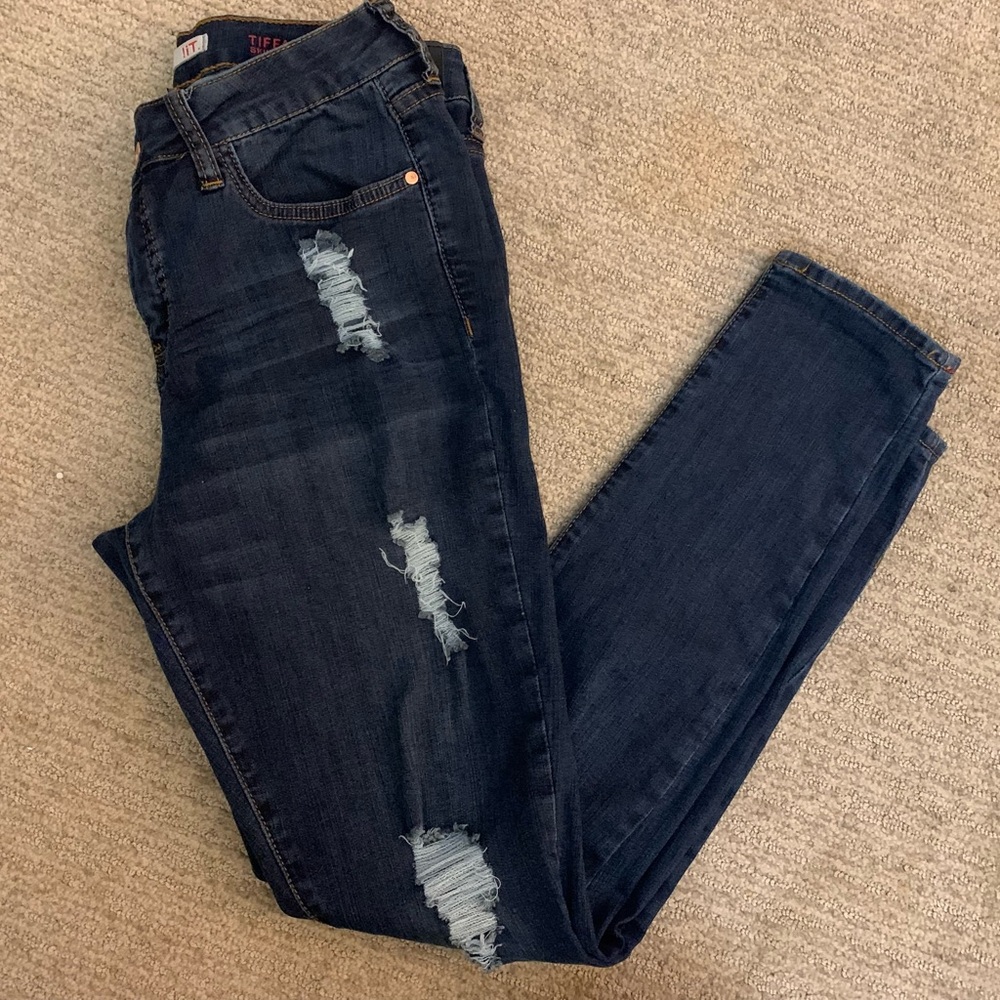 medium wash denim skinny jeans w/ distressed details